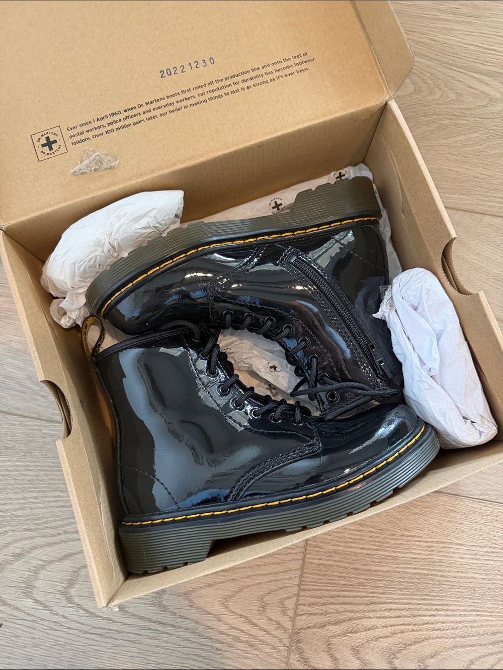 Dr. Martens Kids Black Patent Leather Ankle Boots with Yellow Stitching